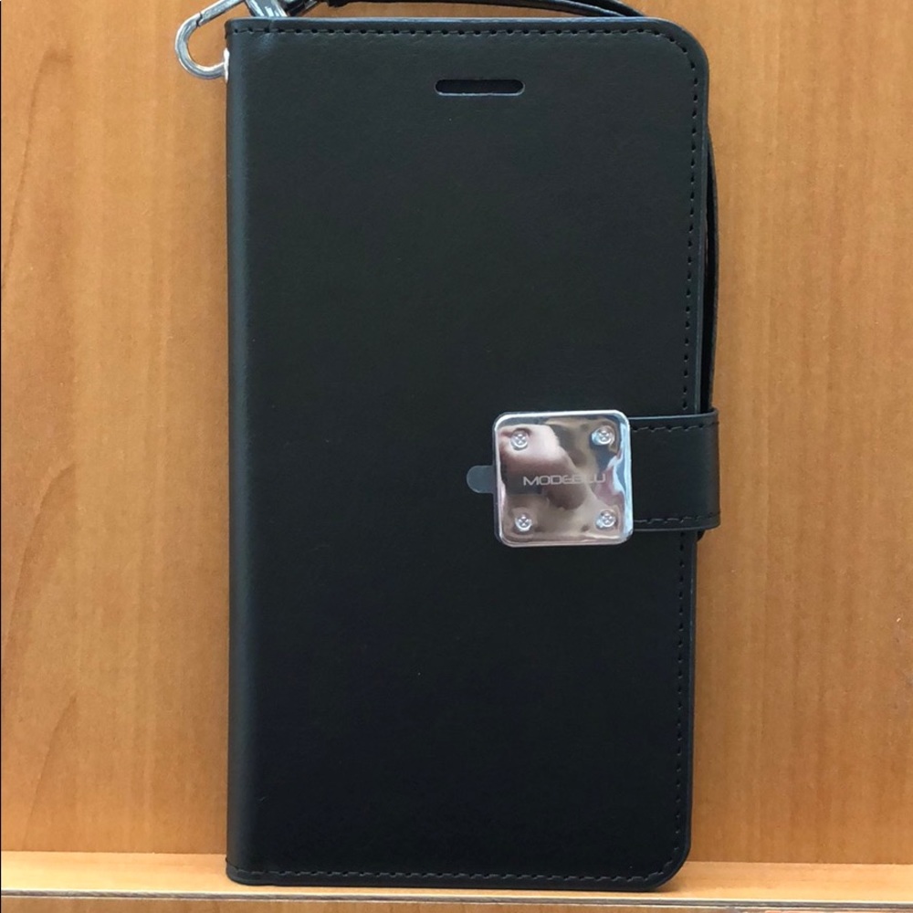 Diary/wallet case in black with wrist strap.
